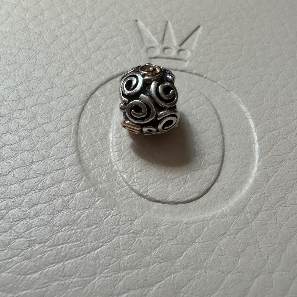 Genuine retired Pandora two tone swirl charm